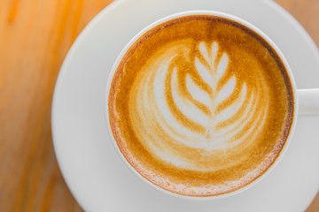 Latte Coffee art on the wooden table