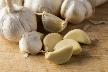 Clove garlic peel on a  board