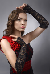 Studio portrait of a young beautiful woman with professional makeup and hairstyle