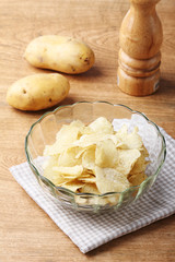 Delicious potato chips in bowl