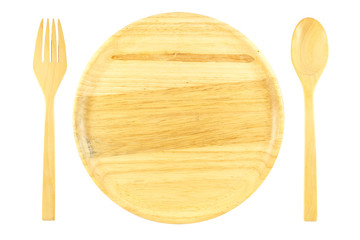 Wooden plate and spoon on white