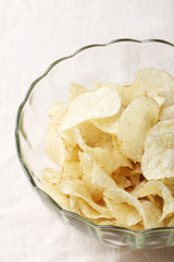 Delicious potato chips in bowl