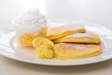 Pan cake with ice cream on table