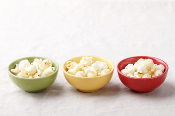 three bowls of popcorn