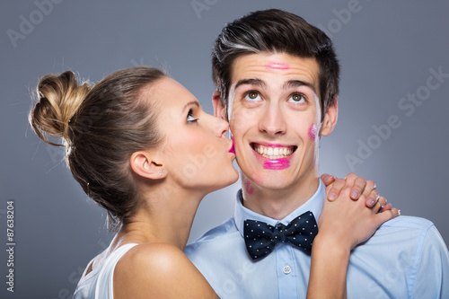 &ldquo;Young woman kissing man&rdquo; photo libre de droits sur la banque d&rsquo;images