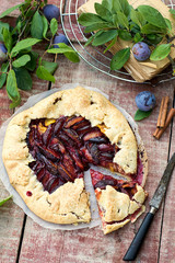 Rustic galette fruit tart with plums and cinnamon
