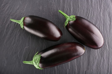 Fresh eggplant on wooden background