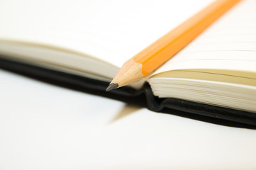 Notepads and pencil  on a white background