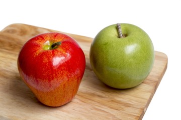 apple with wood cutting board on white background
