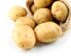 Young potatoes in sackcloth bag isolated on white