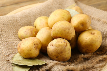 Young potatoes on sackcloth close up