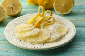 Ripe lemons on wooden table close up