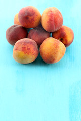 Sweet ripe peaches on table close up