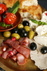 Ingredients of Mediterranean cuisine, on wooden tray, on wooden background