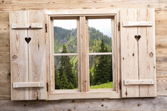 Fototapeta Wooden window with mountain reflections
