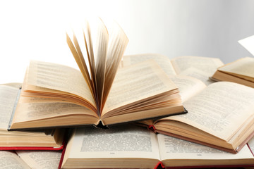 Many open books isolated on white