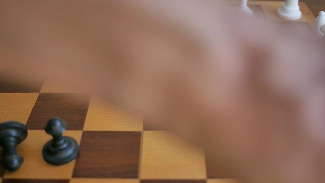Scattering chess pieces while playing chess