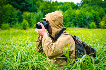 photographer takes pictures in a swamp