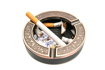 Fototapeta premium ashtray with cigarette butts and portrait of child