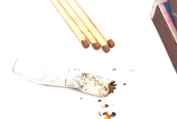 matchbox, matches and butt with filter on white