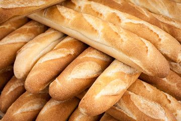 Bread. Full frame detail on a pile of French Baguettes.