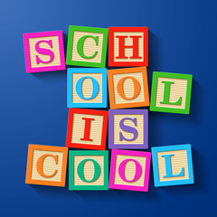 School is Cool phrase compiled with wooden alphabet blocks
