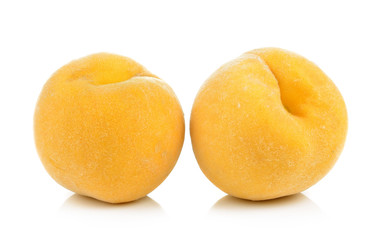  ripe yellow peach on white background