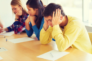 group of students with papers