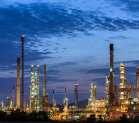 il refinery at twilight with sky background.