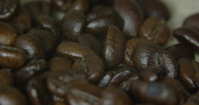 Brown coffee beans, close-up of coffee beans for background and textures