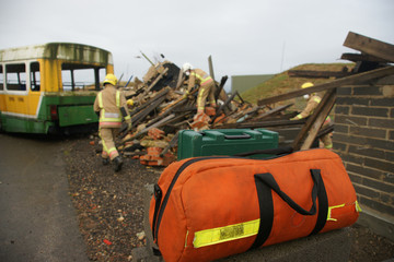 Fototapeta premium fire-fighters at building collapse disastor