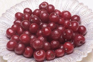 Sour cherry on a silver plate