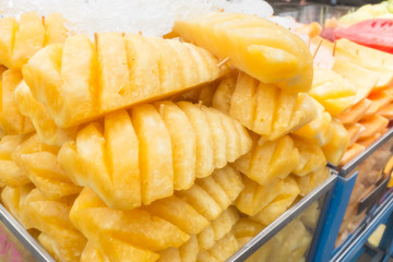 Thailand street food fresh pineapple sell on the handcart.