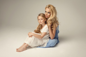 Fototapeta na wymiar Attractive blond woman with her daughter