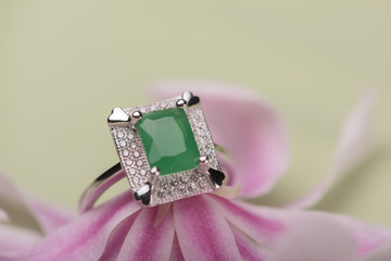 Green stone ring on a flower