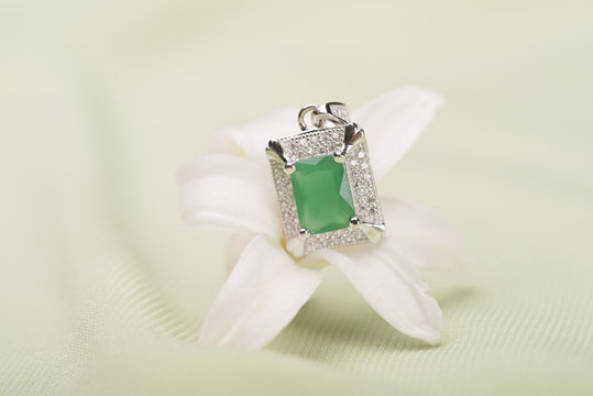 Green stone ring on a flower