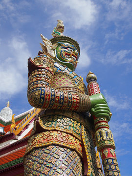 The ancient statue of giant guardian at the Grand Palace in Bangkok