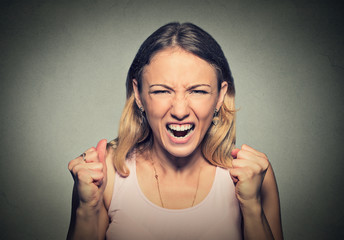 portrait of young angry woman screaming