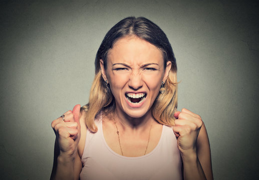 portrait of young angry woman screaming
