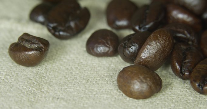 Brown coffee beans, close-up of coffee beans for background and texture.