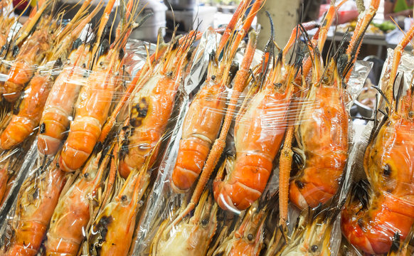 Thailand street food grill tiger prawn in plastic wrap and ready