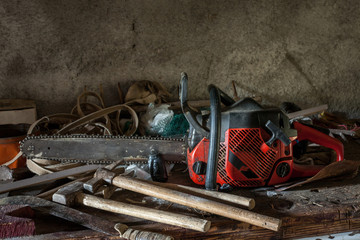 Fototapeta na wymiar Dirty chainsaw and tools