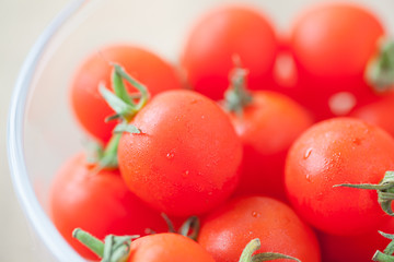 Stack of Fresh cherry tomato in glass cup