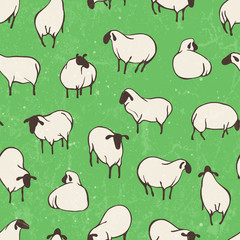Pattern with sheep on a green field.