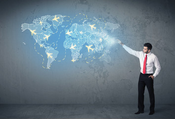 Business person showing digital map with planes around the world