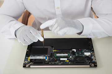 Fototapeta na wymiar Technician Repairing Laptop