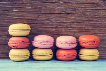 macarons on a blue rustic surface, cross processed