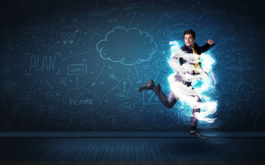 Happy business man jumping with storm cloud around him