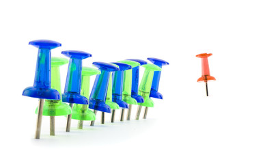 First one to follow. Stop at red sign.
Pin photo illustration. Blue and green push pin set in line, one red pin in the end of the line.