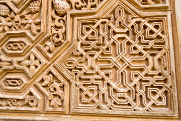Carving on a wall in Alhambra